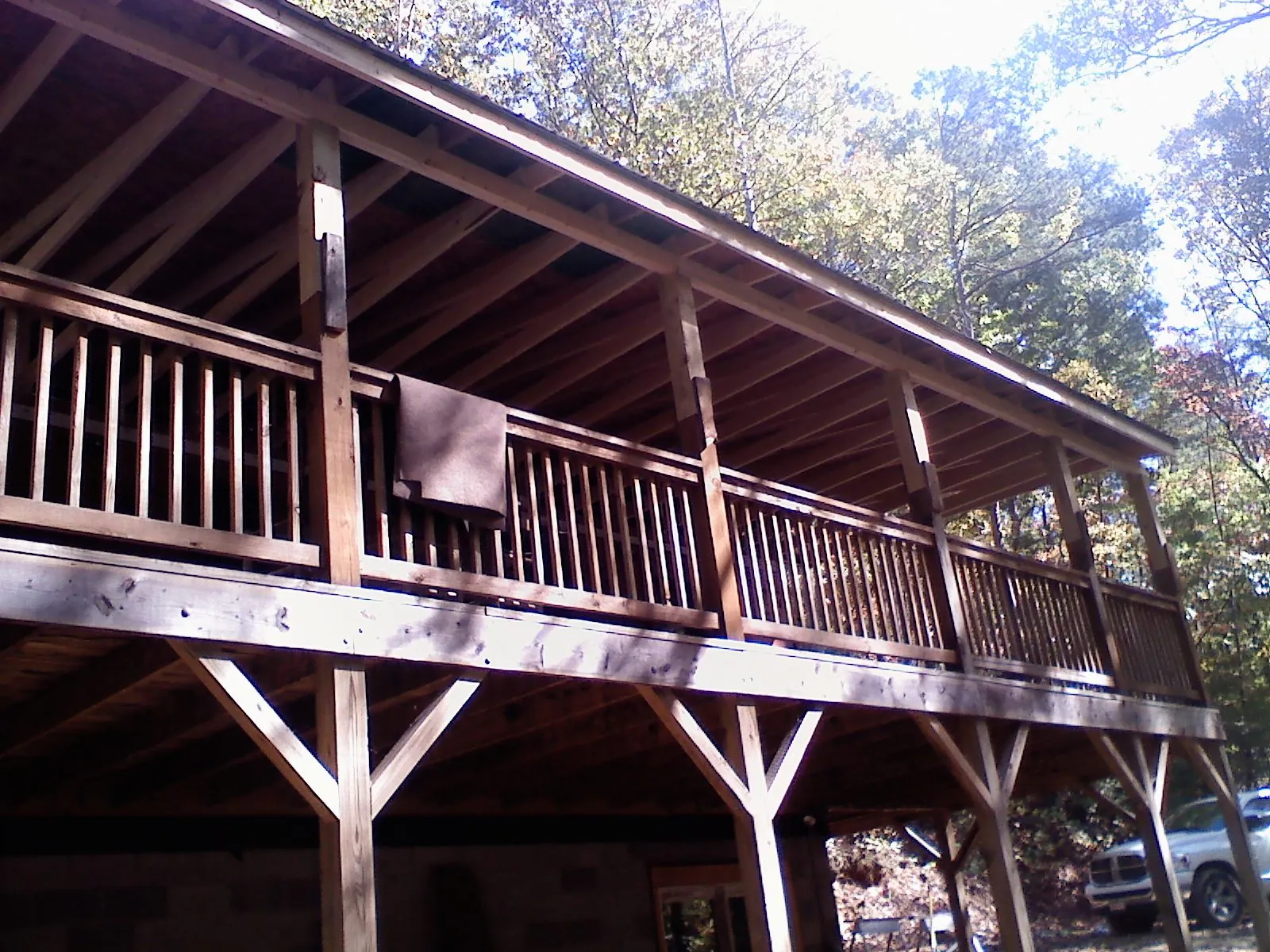 Timber framing under a new elevated porch and deck — Roof Leak Repair in Millheim by Roofing Brothers